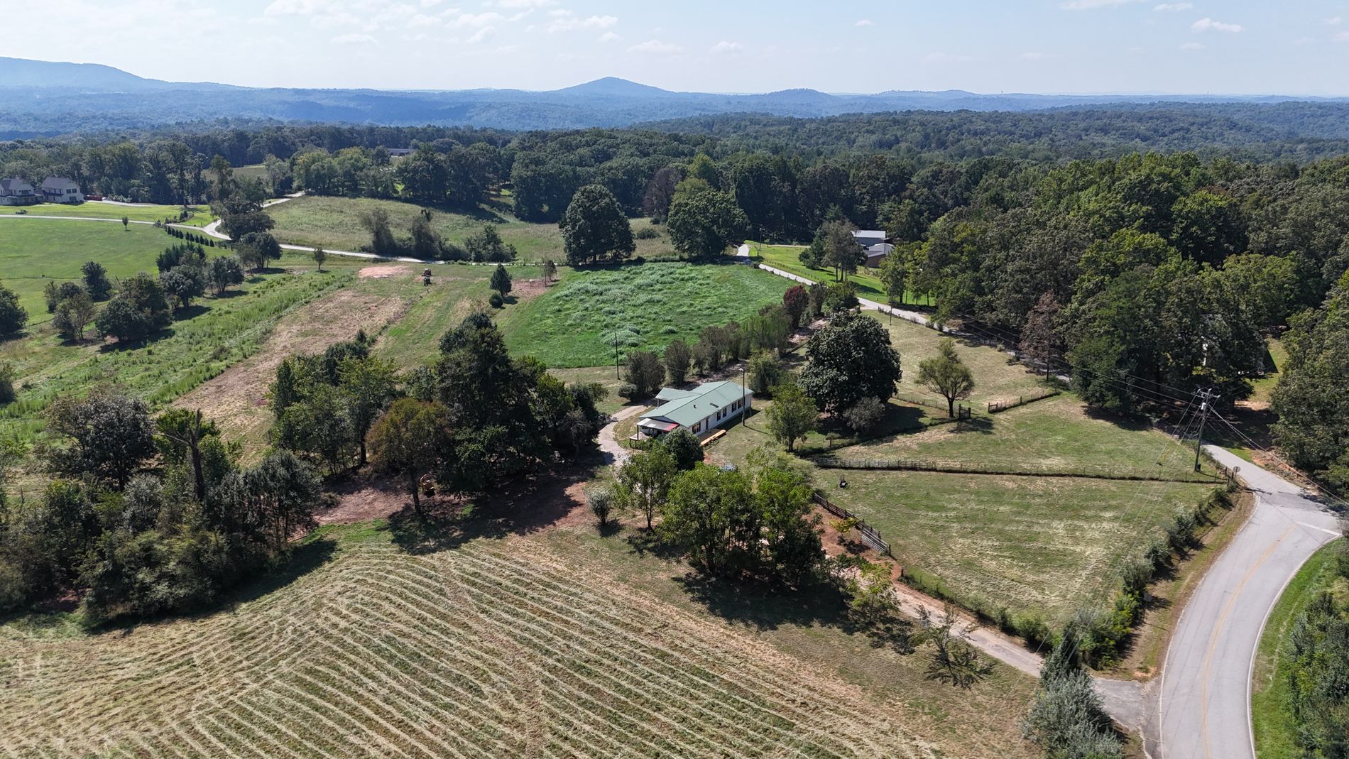 Aerial view across the pasture with the Blue Ridge Mountains on the horizon